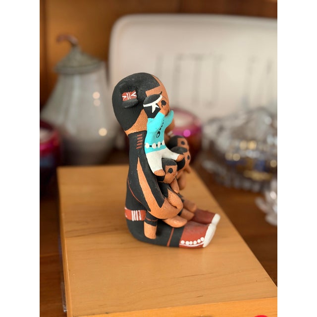 This is a Native American storyteller figurine of a mother holding 5 children. Signed by artist Margaret Quintana from...