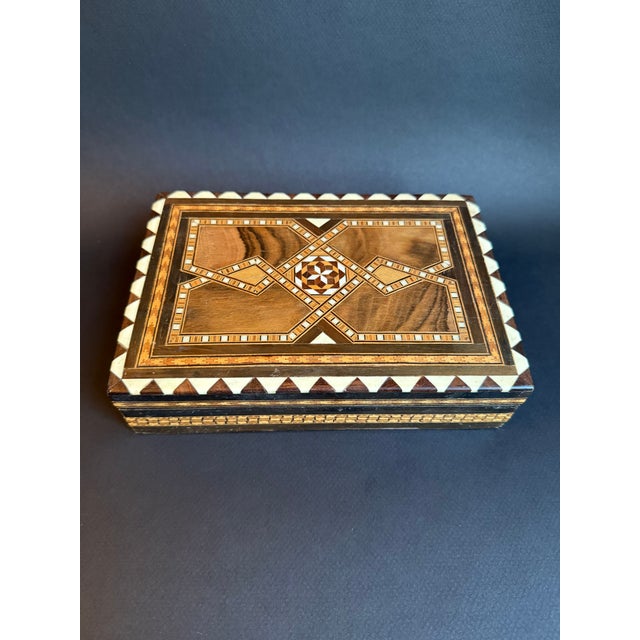 Wooden marquetry box made in Madrid, Spain in early 19th century. The intricate design with bone or shell inlay covers 5...