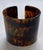 This is a classic cuff made of acrylic resin in a handsome faux tortoise pattern. 2 ⅛W x 1 ¾D x 1 ⅞H circumference 6 ⅜