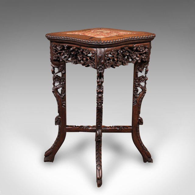 This is a small antique jardiniere stand. An Oriental, mahogany and marble wine or lamp table, dating to the Victorian...