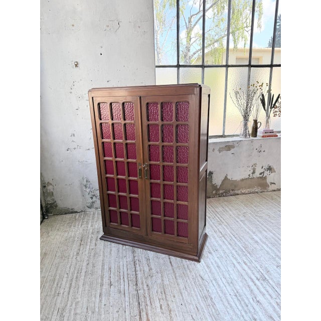 Antique small glass-fronted cabinet from the art deco period, dating from the 1940s. we love its small size, its two glass...