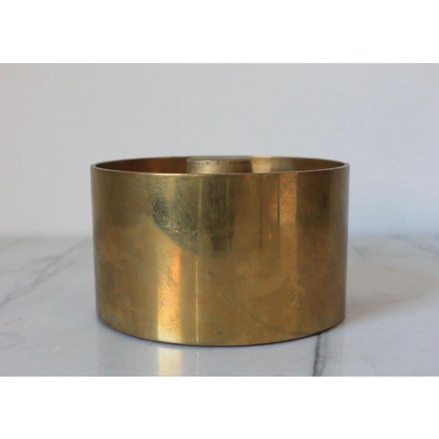 Vintage lidded heavy brass container by Chapman. Dated 1982. Some age wear and patina to brass. Makers mark on the bottom.