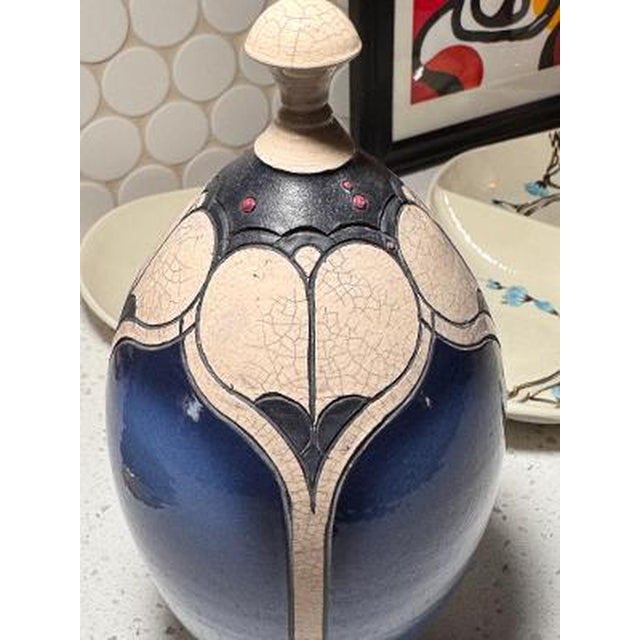 A sculptural lidded raku pottery vessel by North Carolina ceramic artist Andy Smith, distinguished by its deep cobalt-blue...