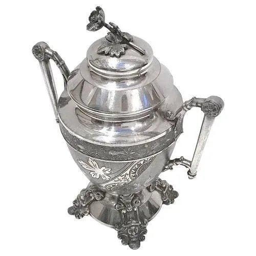 Antique Aesthetic Movement lidded sugar urn with leaf embellishments on the body and supported with greenface ornamental...