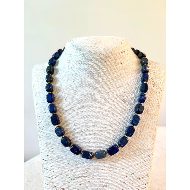 Gorgeous lapis beaded necklace with gold tone, clasp, and spacers designed by Matthew Izzo collection