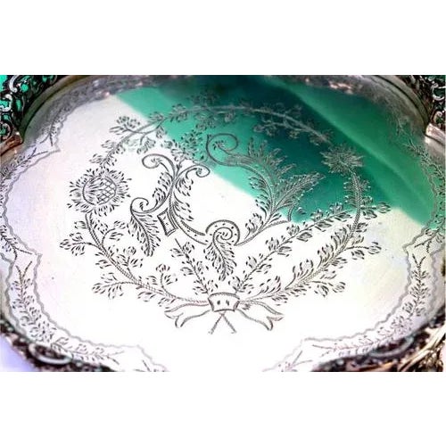Silver Plated Salver with Scalloped and Guilloche Grid, in Very Good conditions. Designed 1920 to 1949 This piece has an...