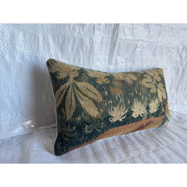 17th century Flemish tapestry decorative pillow made from an authentic handwoven wool tapestry fragment. The textile...