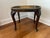 An elegant vintage Queen Anne style mahogany tray top side table. Table features a rectangular top with rounded corners...
