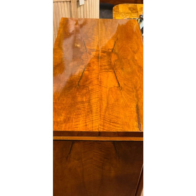 Handsome 19th century German Biedermeier commode. Featuring a gorgeous walnut polished finish with bronze hardware. A...