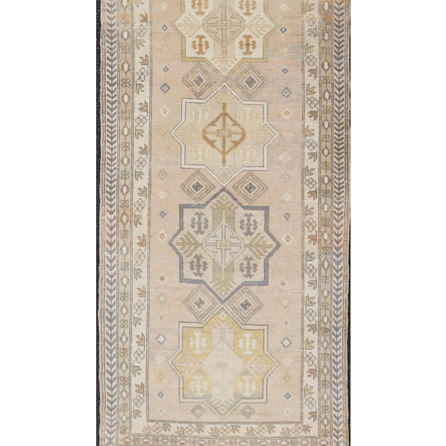 Tribal Antique Turkish Oushak Runner With Soft Gold and Celadon Geometric Medallions For Sale - Image 3 of 13