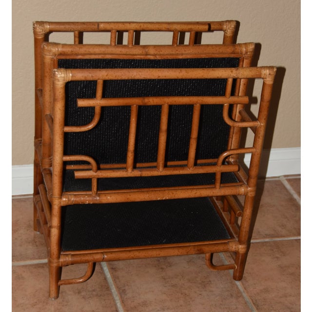 Chinoiserie style bamboo magazine stand/rack by. The ractangular case is divided into two deep pockets and has a lower...