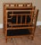 Chinoiserie style bamboo magazine stand/rack by. The ractangular case is divided into two deep pockets and has a lower...