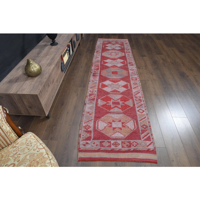 Vintage Turkish Hand-Knotted vintage rug is a semi-antique vintage runner rug. The '70s Eastern region of Turkey's unique...