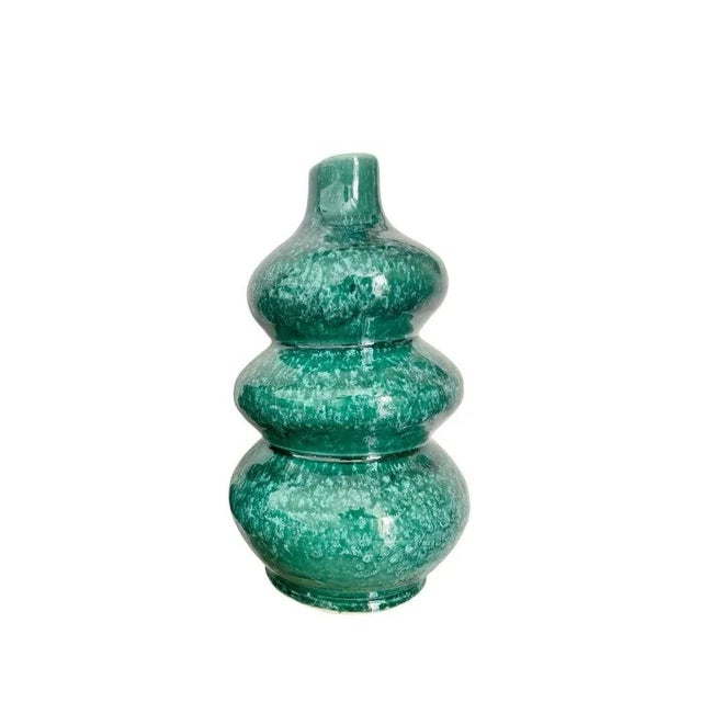 The rich and soothing shade of this vase adds a touch of freshness to your space. The painted finish gives a delicate...
