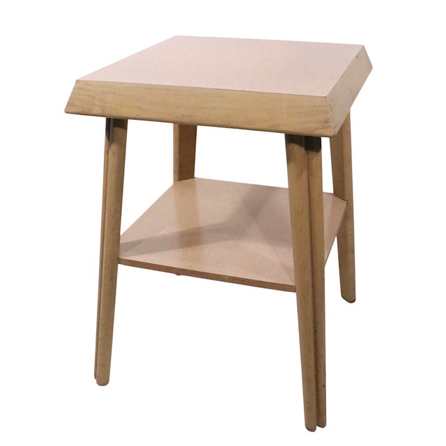 Mid Century two tier end, or side, table, having a bleached oak frame, and formica table top surfaces. As the tops are...