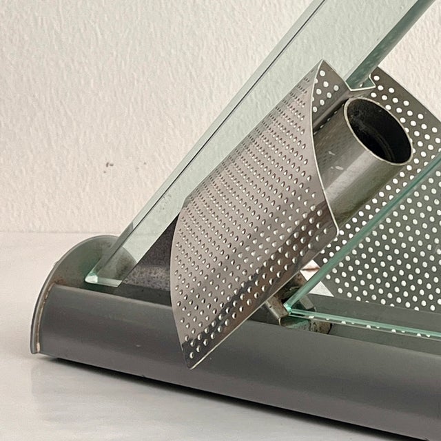 A rare and captivating pair of "Icaro" wall sconces, designed by renowned designer Carlo Forcolini and produced by the...