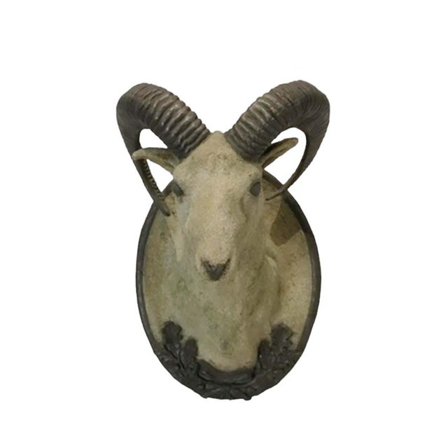 A striking cast composite model game mount featuring a majestic ram with finely sculpted details and black painted...