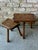 Pair of small scale wooden nesting side tables from France. The top of larger table is a slightly irregular shape, making...