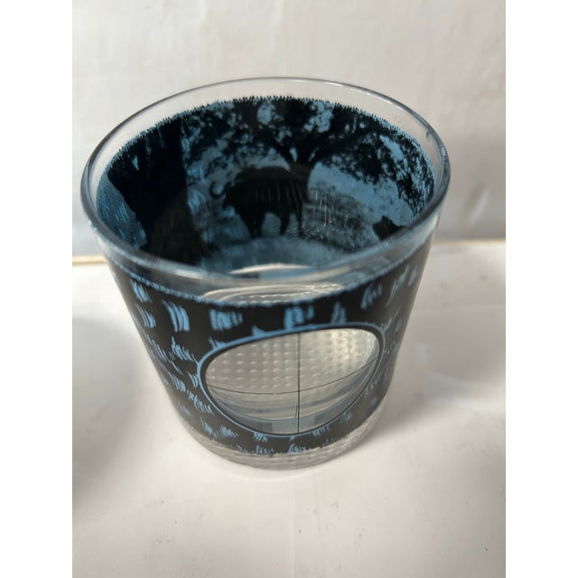 set of seven lowball glasses with different animal prints and scenes on each glass. would look great in a man cave or bar...