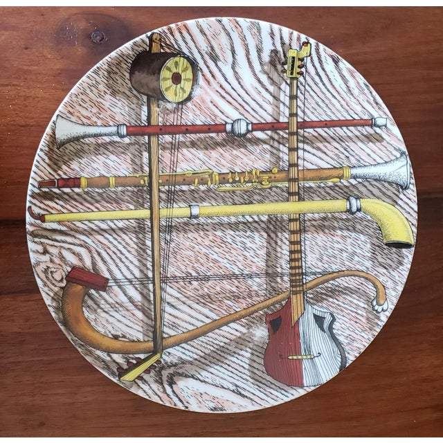 Piero Fornasetti Porcelain Orchestra Pattern Plates with Musical Instruments, Set of 15, Circa 1980 Fifteen different...