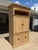 Huge cabinet with traditional paneled doors, and original decorative hardware. Large open door compartment and enclosed...