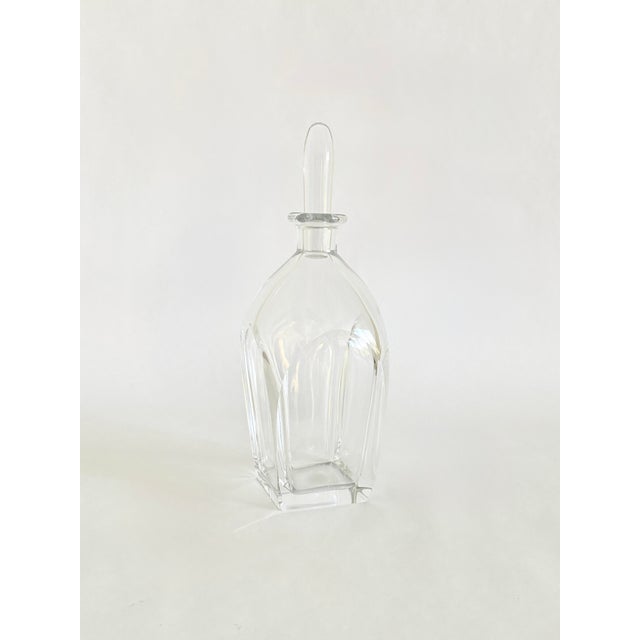 A Scandinavian modern crystal decanter designed by Vicke Lindstrand for Orrefors, Sweden. Dating to the 1930s, the...