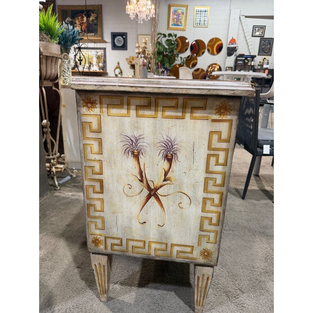 An elegant handcrafted console table by The Platt Collections, featuring a warm tan finish with beautifully detailed...