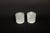 This pair of luminous selenite votive holders is a captivating addition to any space, designed to hold standard tea light...