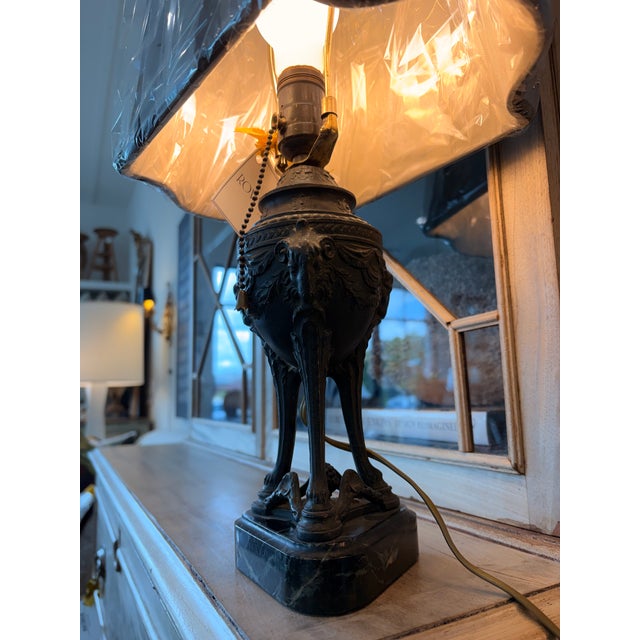 Metal lamp with detailed engravings. Marble base.&nbsp;