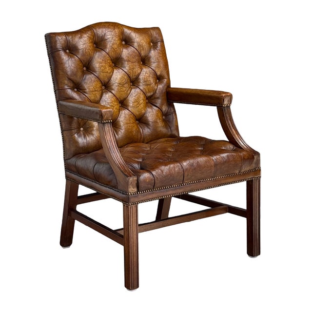A fine Gainsborough library armchair or lounge chair upholstered in patinated leather from England - featuring a high...