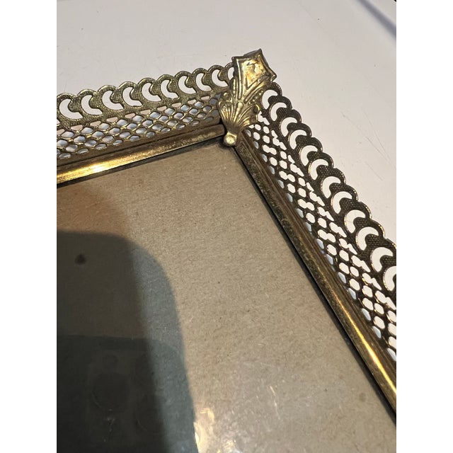 This vintage-style ornate gold filigree metal picture frame is designed for tabletop display with an easel back. Features...