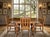 Step back in time with this breathtaking 1925 Jacobean-Elizabethan solid oak draw-leaf dining table, complete with its...