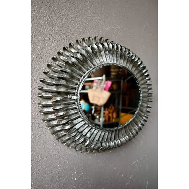Large oval mirror from the 1950s. Metal frame, curved stems. In good condition, very decorative. Some traces of oxidation...