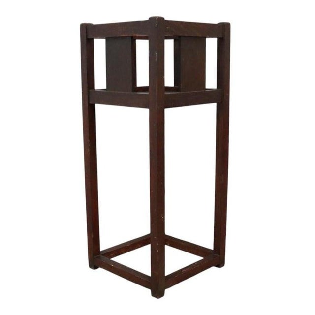 An antique plant stand crafted in the distinctive Arts & Crafts style, in the manner of Stickley. This piece features...