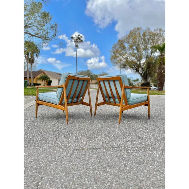 Pair of Rail-Back Lounge Chairs in the Style of Viko Baumritter. Two beautiful lounge chairs with stunning wood grain...