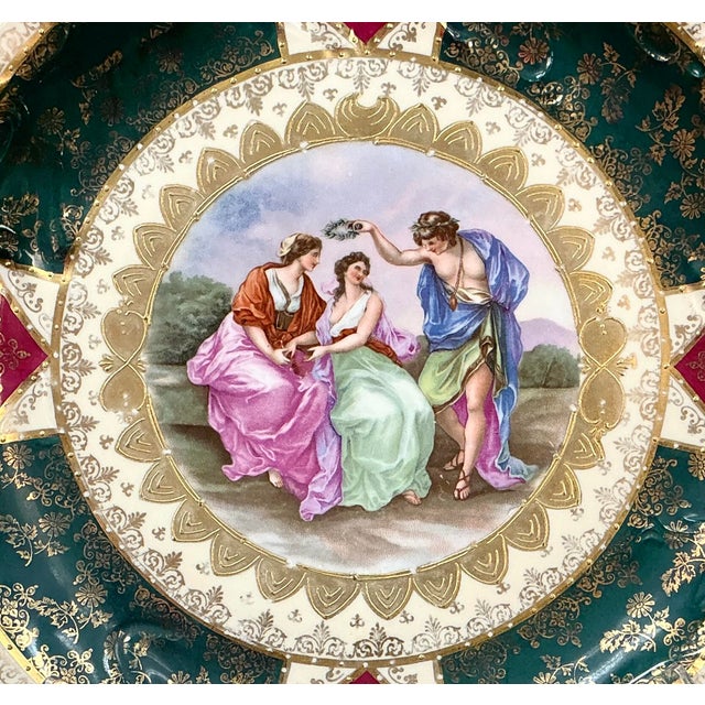Royal Vienna Style Porcelain Cabinet Plate. Plate features a hand-painted classical figurative scene depicting three...