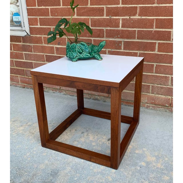 Super vintage mid-century modern small table in walnut with a white laminate top. Would be ideal for drinks or as a plant...