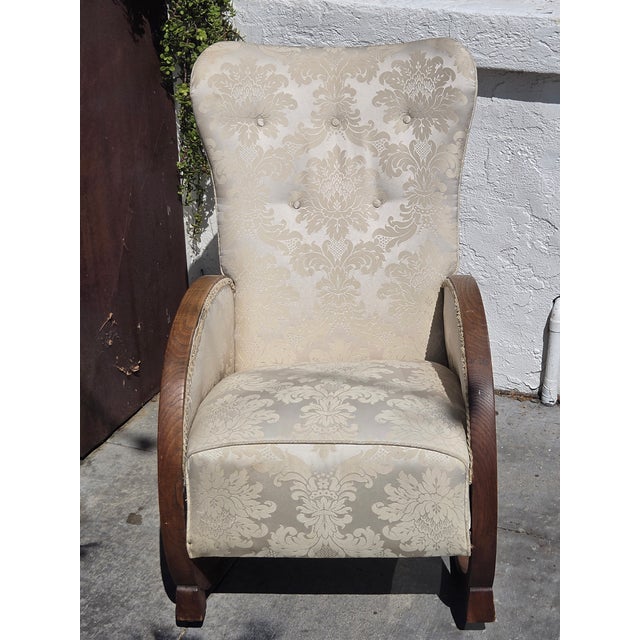 1930s Oak Heals of London Rocking Chair. Fun look and design. Original Fabric would have been simpler and wool.