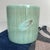 Beautiful vintage Japanese hibachi from the 1970s, featuring a refined turquoise glaze with a striped pattern and an...