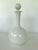 This elegant mid-century milk glass bath oil bottle features a classic bulbous body with a tall, slender neck and a...
