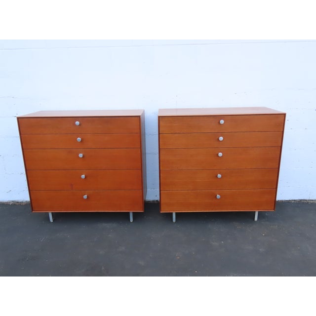 This magnificent Pair a Chest of Drawers is made of wood, walnut, veneer, and metal. We believe the pieces were made by...