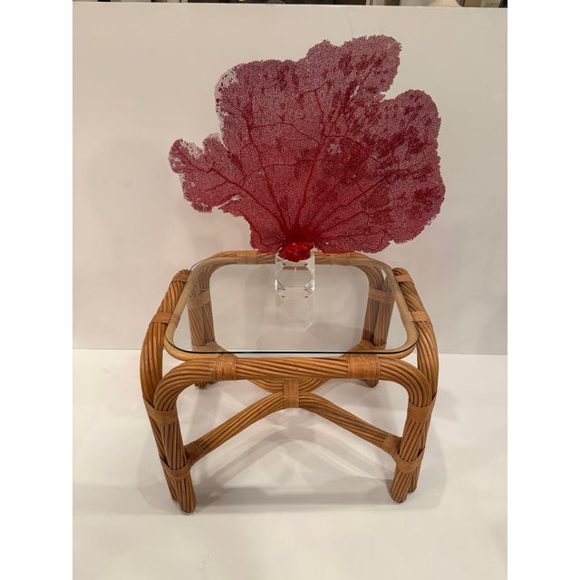 Stylish pair of twisted rattan end tables having glass tops. Great versatile size. RR