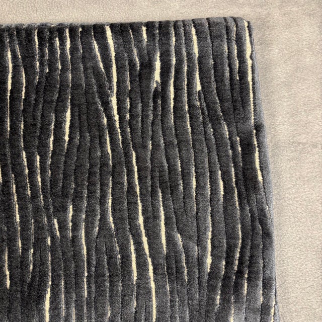 Handmade in the USA, this textured cut velvet throw pillow cover features a rich charcoal black and beige ribbed abstract...