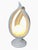 Modern white ceramic sculptural table lamp with abstract intertwined organic forms and glowing spherical orb. Elegant...