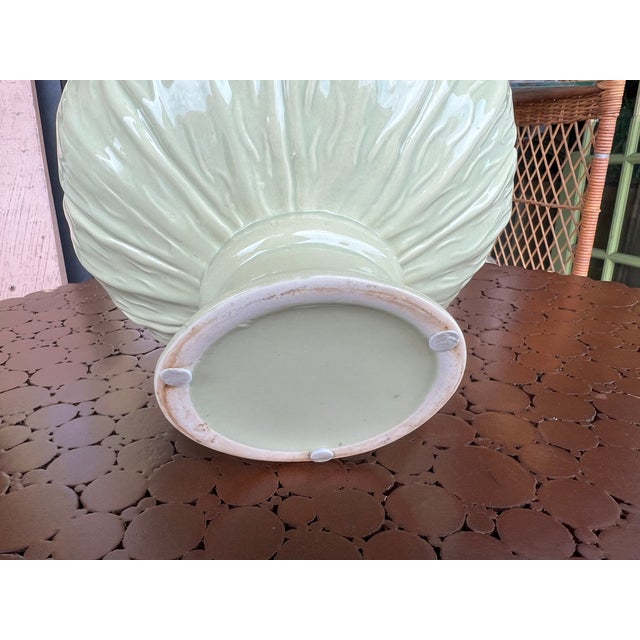 Beautiful shade of soft green. High gloss ceramic planter. Measures 7.25” diameters and stands 5.25” tall.