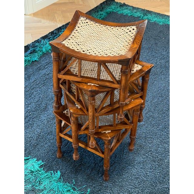 The Thebes stool, originating from the late 19th century and designed by Leonard Wyburd for Liberty & Co., is a timeless...