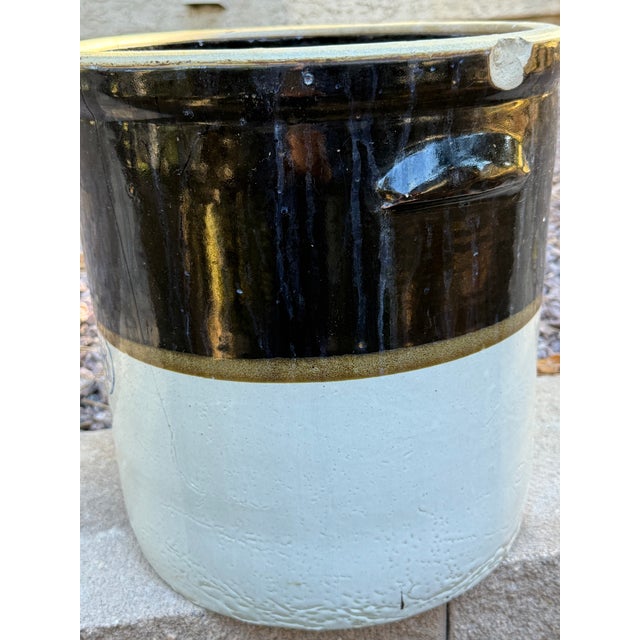 A fantastic, highly collectible antique early 20th century American primitive two tone stoneware utility crock....