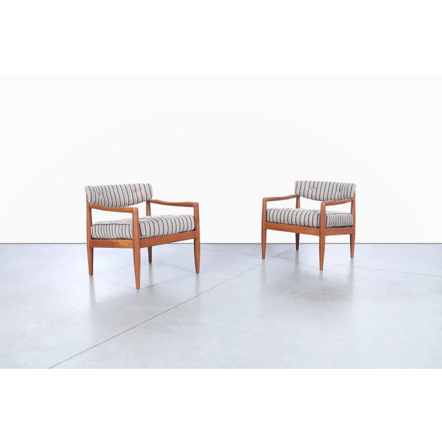 Mid-century modern walnut lounge chairs designed by Adrian Pearsall for Craft Associates, United States, circa 1960s. This...