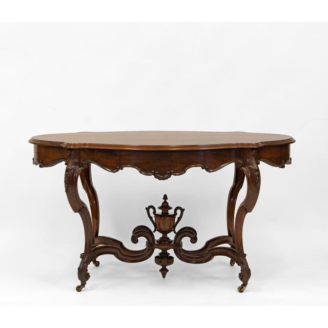 A fine and beautiful antique rosewood rococo revival centre/hall table with two drawers. English, Circa 1850. The table...
