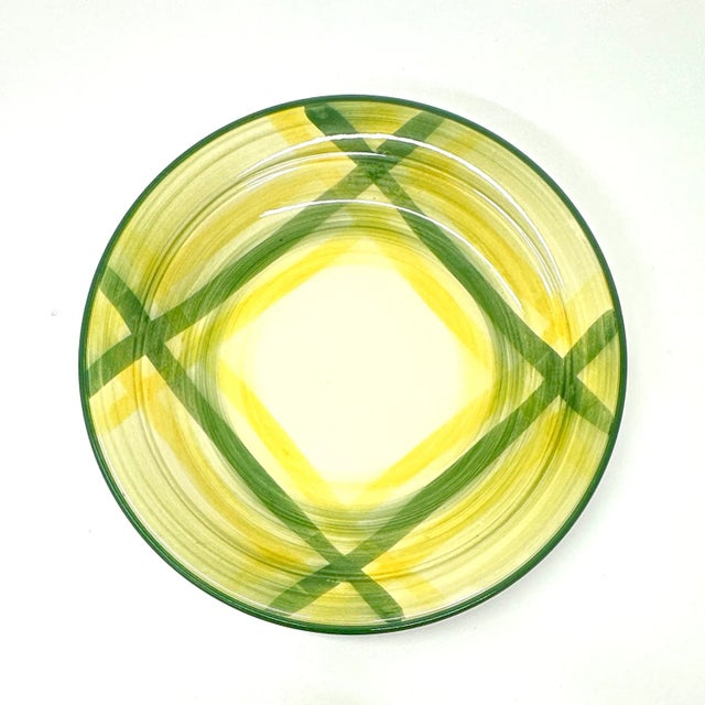 Storybook decorative plates, group of 7. This is a vibrant set of decorative plates featuring a yellow, green, pink, and...